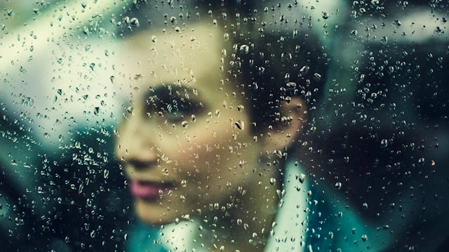 girl watching rain