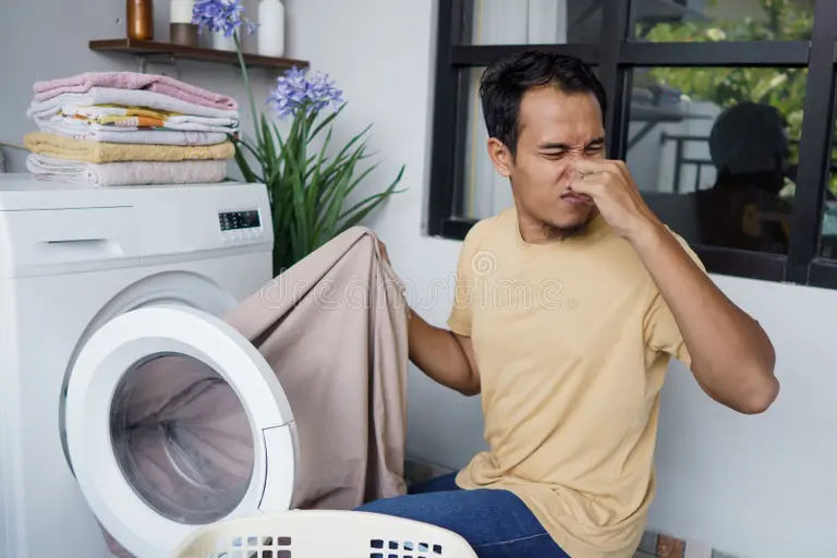 The real reason your washing machine smells so bad